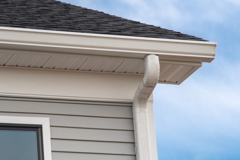 Newly installed white seamless gutters