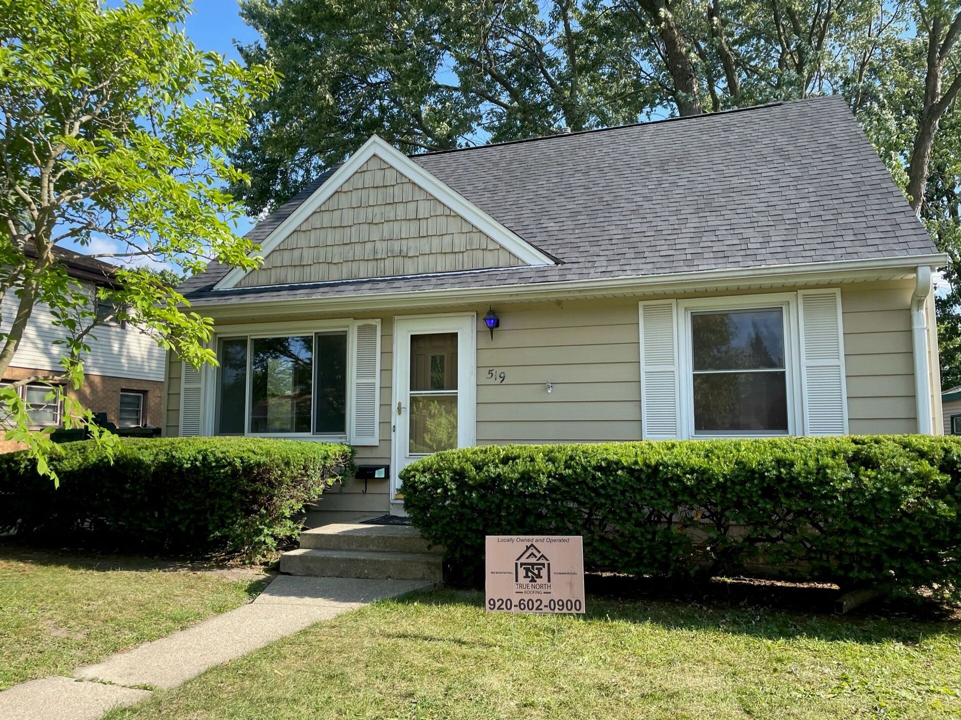 modern farmhouse dark siding roofing project